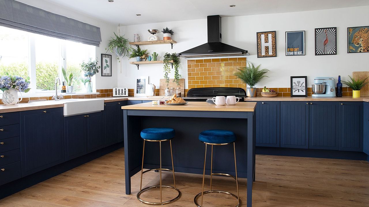 kitchen with wooden flooring and blue cabinets