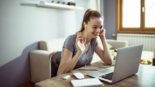 Home working tips to help you feel happy and healthy when remote working: A woman takes part in a video call with her remote team