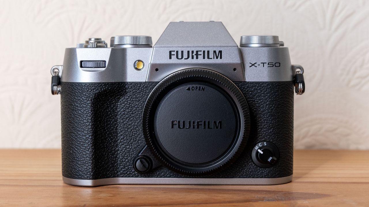 The Fujifilm X-T50 with the protective cap covering the sensor