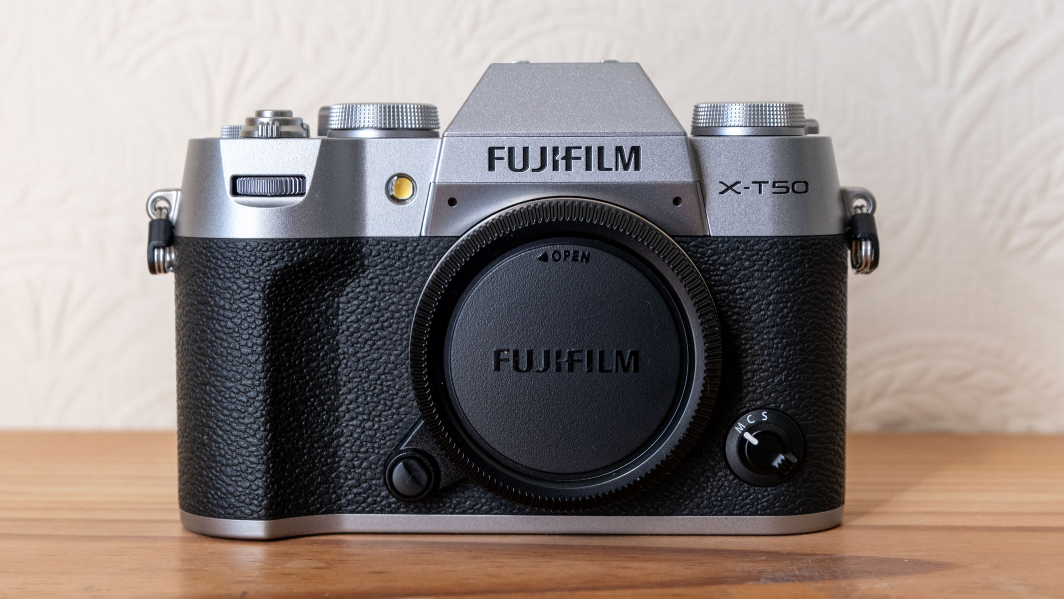The Fujifilm X-T50 with the protective cap covering the sensor