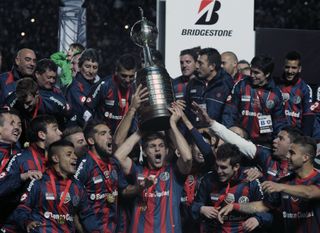 San Lorenzo players celebrate after winning the Copa Libertadores in August 2014.