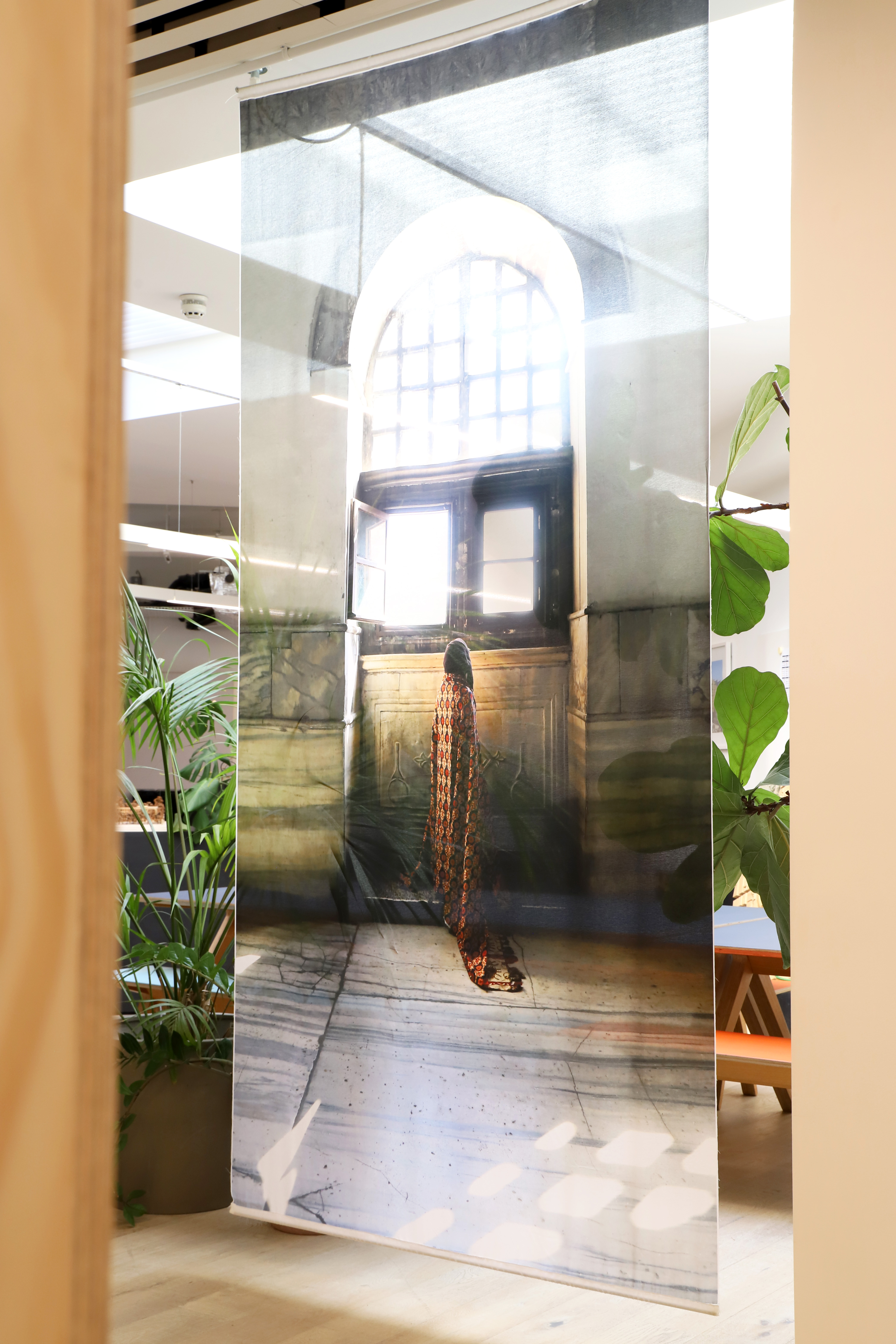 Richly layered interiors and exteriors shots of environments decorated with contrasting patterns, plush textiles, framed original artwork, pastel palettes, and plenty of natural light.
