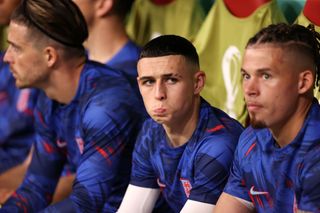 Phil Foden of England reacts in the dugout prior to the FIFA World Cup Qatar 2022 Group B match between England and USA at Al Bayt Stadium on November 25, 2022 in Al Khor, Qatar