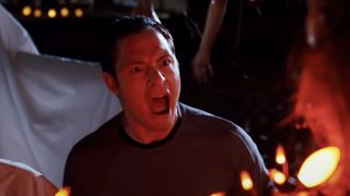 Tahmoh Penikett screams in the middle of his Halloween decorations in Trick 'r Treat.