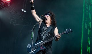 Joe "Spyder" Lester performs onstage with Steel Panther at Hellfest Open Air on June 18, 2022 in Clisson, France
