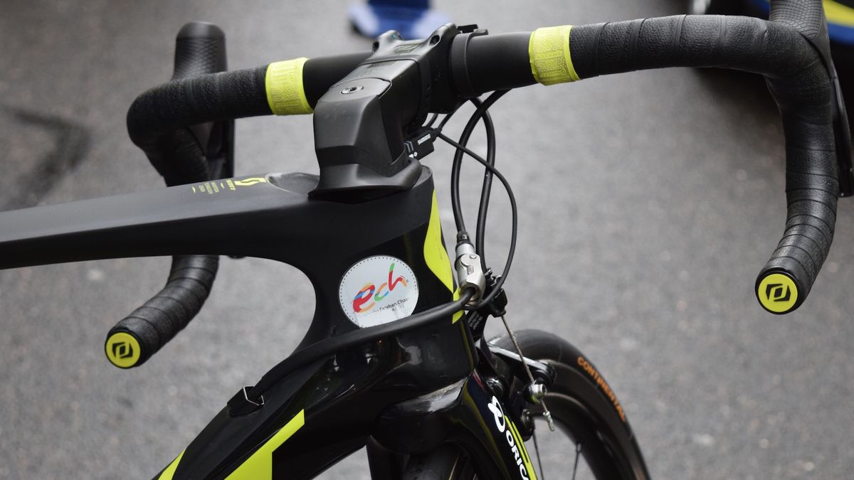 Smiley Colombian Esteban Chaves promotes the Esteban Chaves Foundation on his head tube