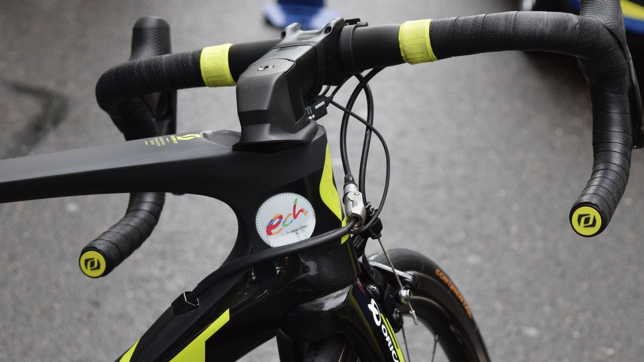 Smiley Colombian Esteban Chaves promotes the Esteban Chaves Foundation on his head tube