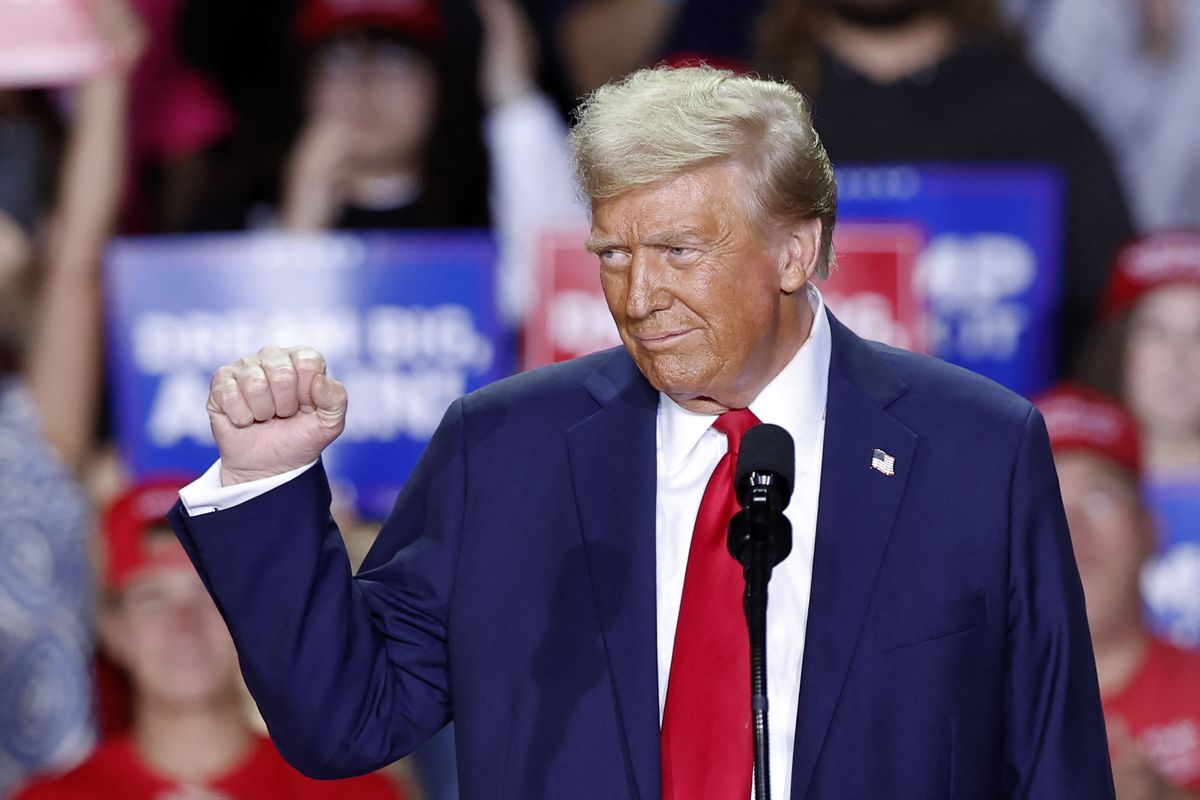 Former US President and Republican presidential candidate Donald Trump gestures as he speaks during a campaign rally at Van Andel Arena in Grand Rapids, Michigan on November 5, 2024. 