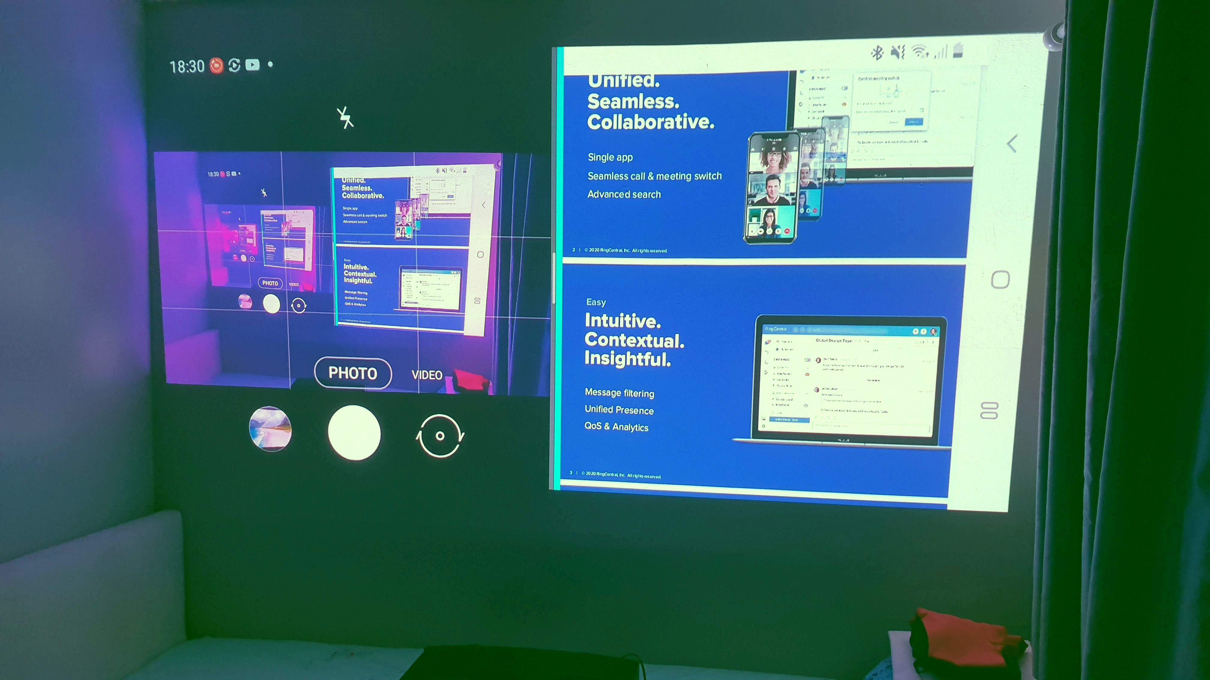 This is a Galaxy Note9 casting to the projector with a split screen. On the right is the presentation, on the left is the camera capturing the scene.