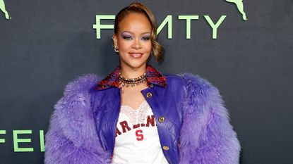 Rihanna in a purple coat, jeans, and jersey at Fenty x Puma's launch party