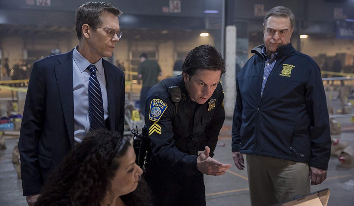 Patriots Day Kevin Bacon Mark Wahlberg and John Goodman look over evidence