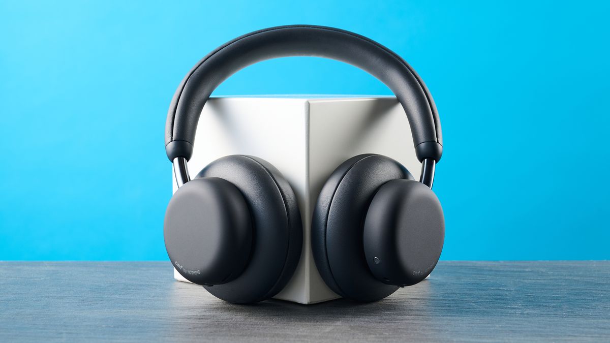the cmf headphone pro / cmf by nothing headphone pro / nothing headphone pro in black photographed against a blue tom's guide background