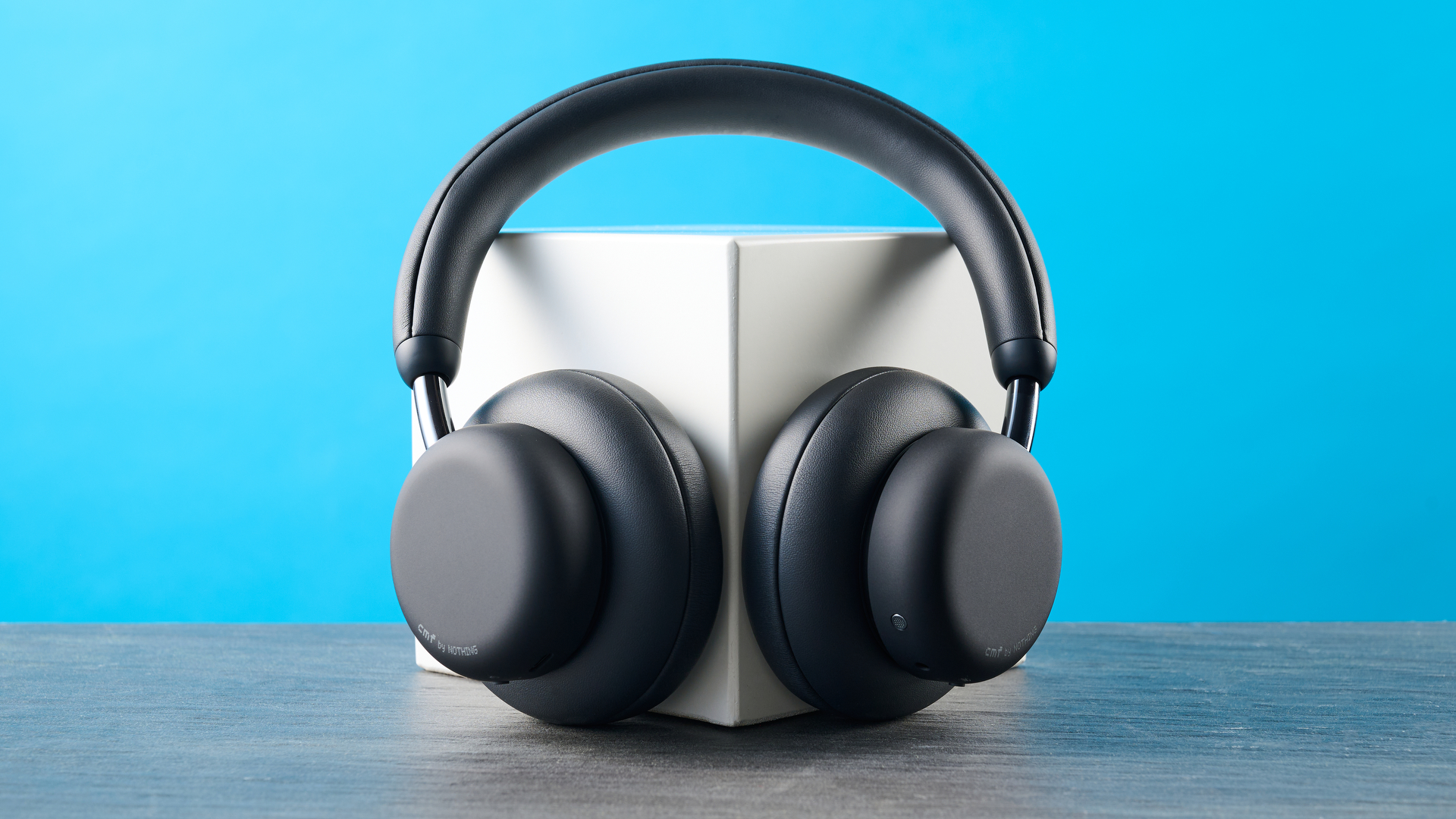 the cmf headphone pro / cmf by nothing headphone pro / nothing headphone pro in black photographed against a blue tom's guide background