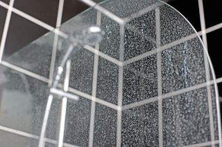 hard water leaves limescale deposits on shower screens, shower heads and taps
