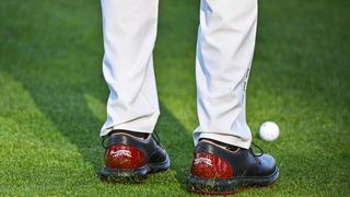 Tiger Woods wearing Sun Day Red shoes at a practice round before the Genesis Invitational