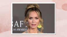 Emily Blunt is pictured with a wavy bun whilst attending the 2024 EE BAFTA Film Awards at The Royal Festival Hall on February 18, 2024 in London, England/ in a pink watercolour template
