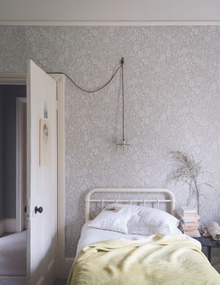 Atacama 5801 Purbeck Stone No.275 and Ammonite No.274 wallpaper from Farrow & Ball in bedroom with long wired ceiling pendant light