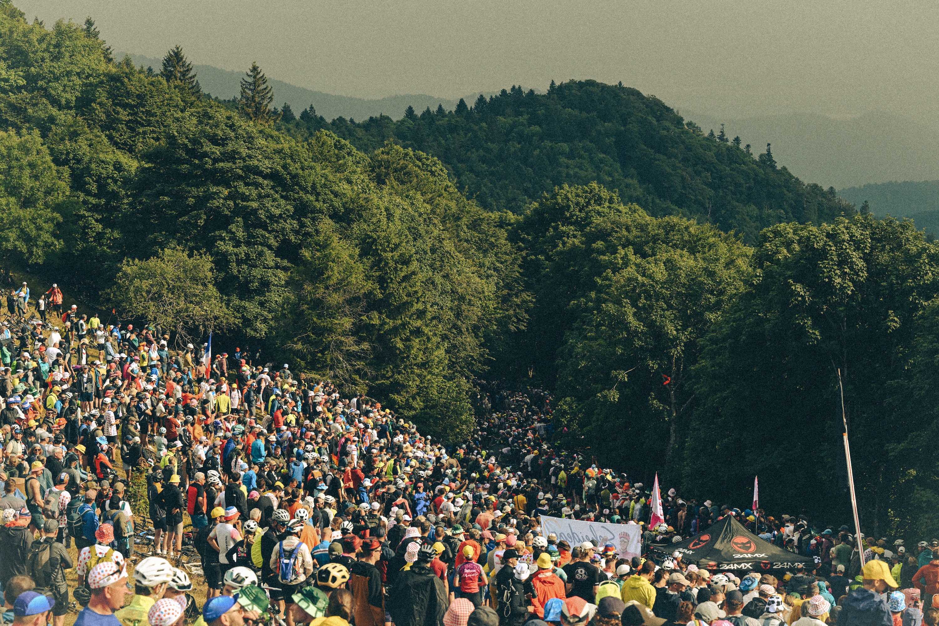 LE MARKSTEIN, FRANCE - JULY 18: (EDITOR'S NOTE: Tonal effects have been applied to this image) Fans cheers in the Col du Haag (1225m) during the 113th Tour de France 2026 - Stage 14 a 155.3km a 155.3km stage from Mulhouse to Le Markstein 1189m / #UCIWT / on July 18, 2026 in Le Markstein, France.