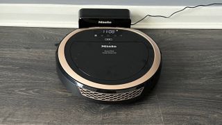 The Miele Scout RX3 Vision HD on its charging dock