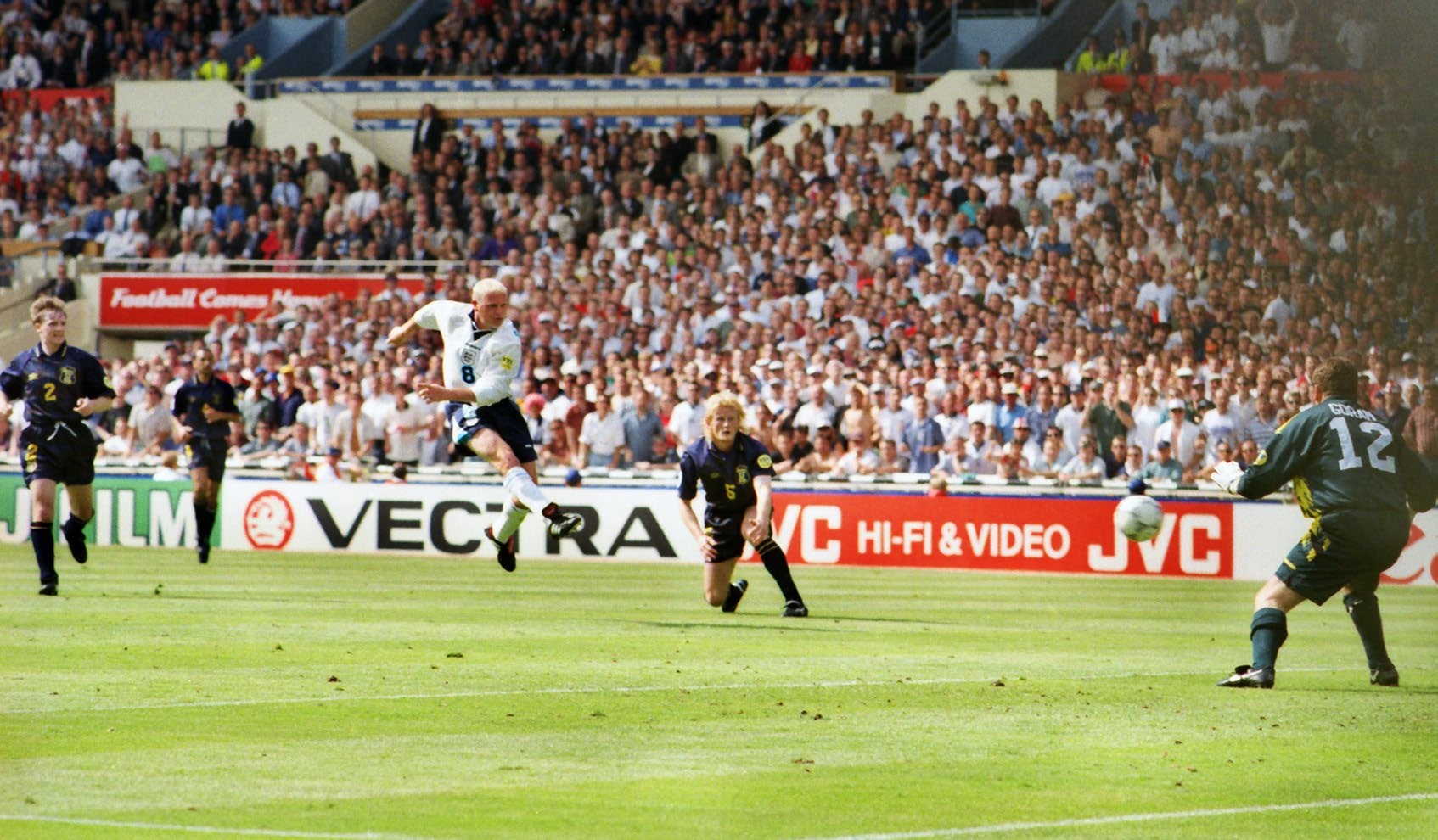 Mandatory Credit: Photo by Colorsport/Shutterstock (3156034a) Football - Euro 96 - Group A: England 2 Scotland 0 (15/06/96) Paul Gascoigne scores a brilliant volley past Andy Goram (right) and Colin Hendry at Wembley Euro 1996 Grp A: Scotland 0 England 2 Sport