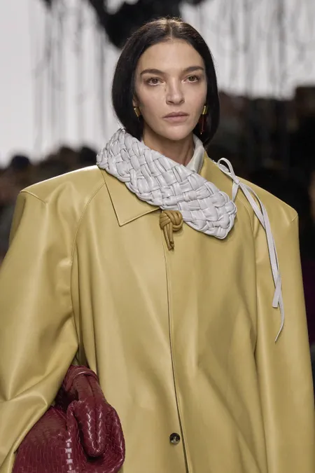 Boxy trenchcoats with Intrecciato detailing at Bottega Veneta