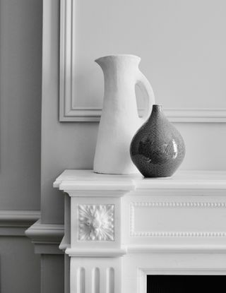 mantelpiece with ceramic jug and vase