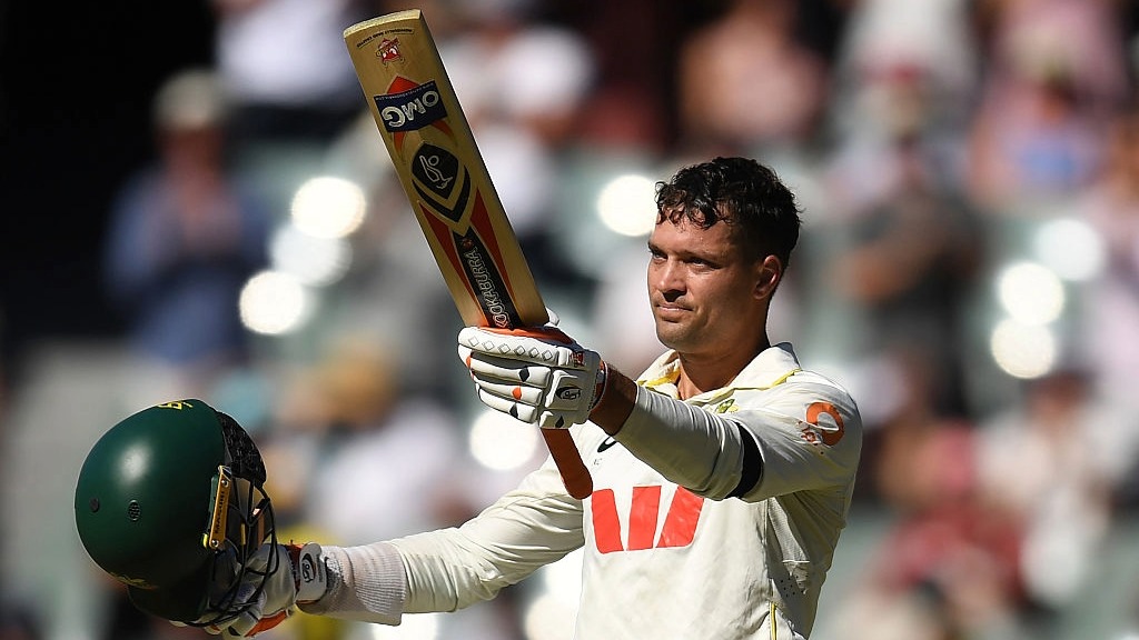Australia wicket-keeper batter Alex Carey raises his bat to celebrate scoring a century on Day 1 of the 3rd Ashes Test against England
