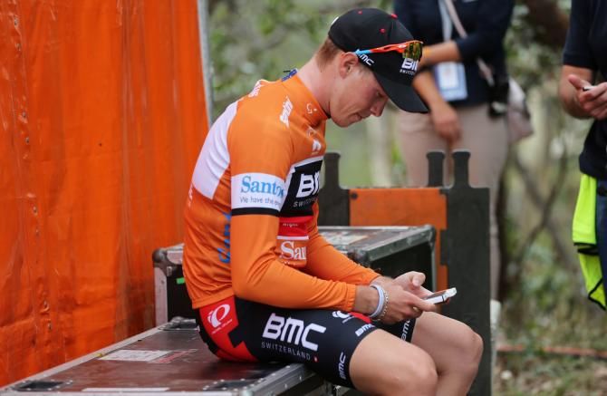 Rohan Dennis (BMC) checks his phone