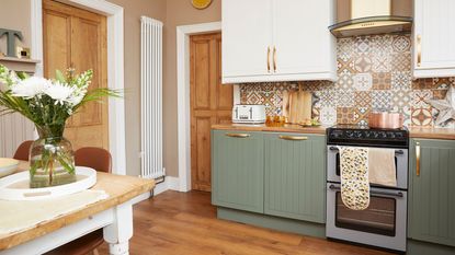 kitchen with green painted cabinets