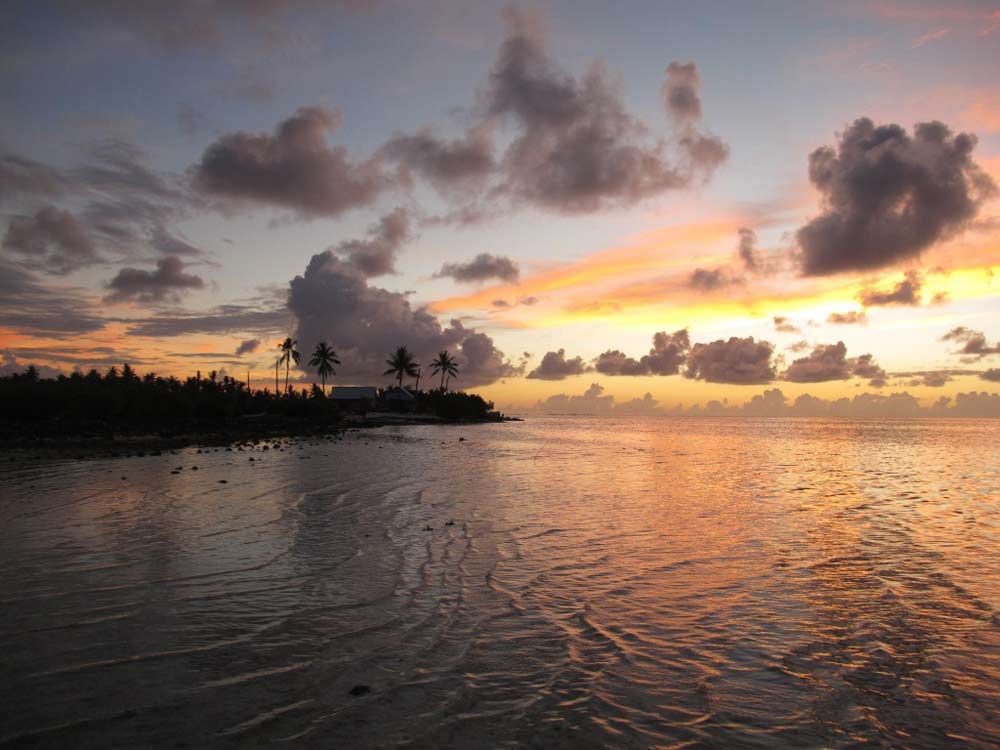 The sun sets on the beautiful atoll of Tarawa, which is being threatened by sea-level rise.