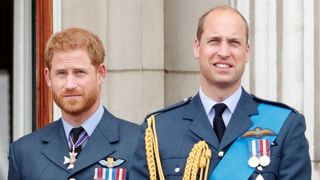 Prince Harry, Duke of Sussex and Prince William, Duke of Cambridge watch a flypast to mark the centenary of the Royal Air Force