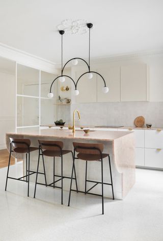 Modern wooden kitchen with statement lighting
