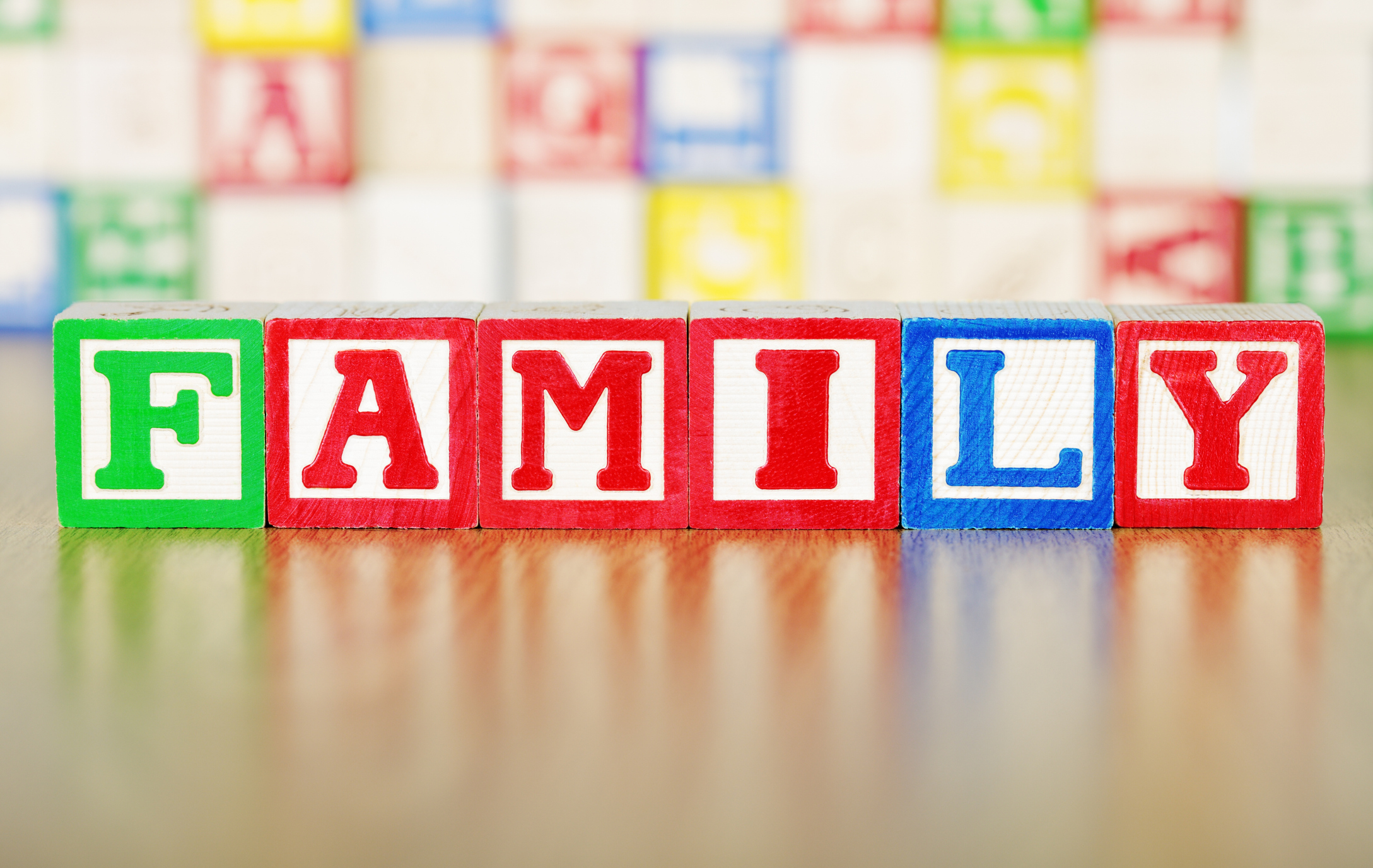 kids&#039; colorful blocks spelling out the word &amp;quot;family&amp;quot;