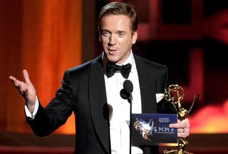 LOS ANGELES, CA - SEPTEMBER 23:Actor Damian Lewis accepts Outstanding Lead Actor in a Drama Series for "Homeland" onstage during the 64th Annual Primetime Emmy Awards at Nokia Theatre L.A. Li