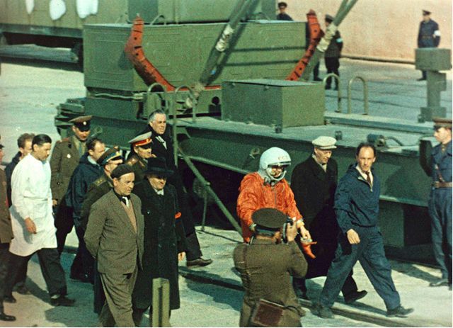 Russian spacecraft designer S. P. Korolev (partially obscured, in fedora hat) and cosmonaut Yuri Gagarin approach the launch pad ahead of the April 12, 1961 launch of Vostok 1, the first human spaceflight.