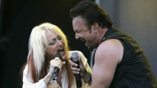 Queensryche’s Geoff Tate and singer Pamela Moore onstage in 2006
