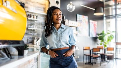 Woman working at a coffee shop. 