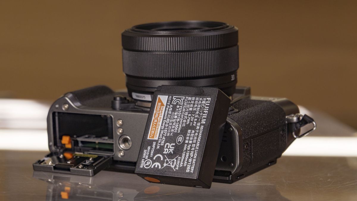 Fujifilm X-T30 III camera on a glass table, battery removed