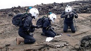 HI-SEAS crewmembers make an excursion onto the surface of a simulated alien world (actually the slopes of Hawai'i's Mauna Loa volcano).