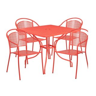 A pink set of metal table and chairs