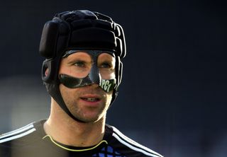 Chelsea goalkeeper Petr Cech, wearing a protective mask and scrum cap, looks on during the Premier League match against Newcastle United in Newcastle, England, December 2011.