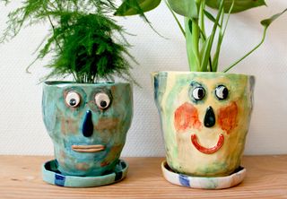 Ceramic plant pots with face by Karin Hagen