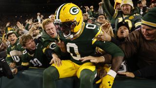 Wide receiver Matthew Golden celebrating with Green Bay Packers fans