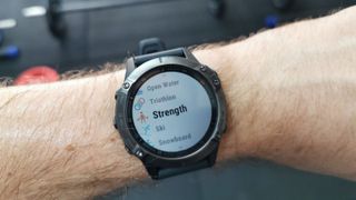 Garmin Fenix 6 showing menu of workout tracking modes