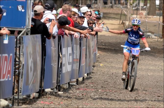 Katerina Nash (Luna Pro Team) hi fives fans as she defends her US Cup series lead