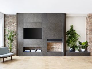 An open concept space with TV hidden inside a unit