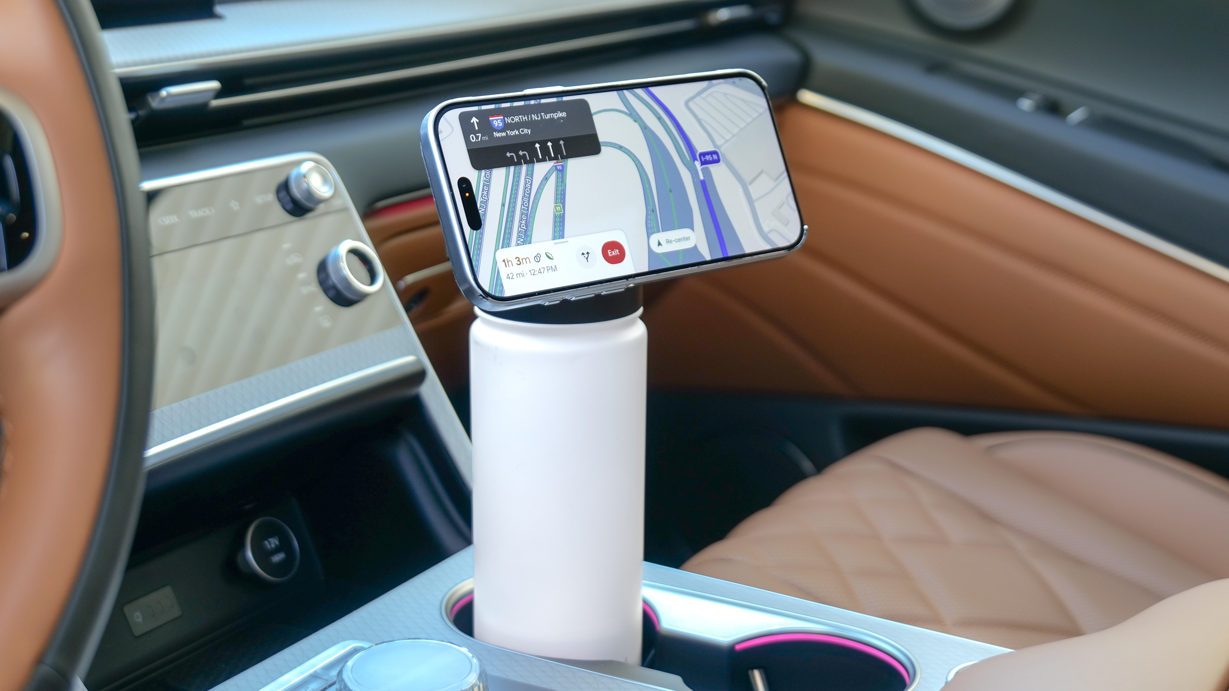 Scosche MagicMount Flask used in car cup holder with iPhone connected to it via MagSafe.