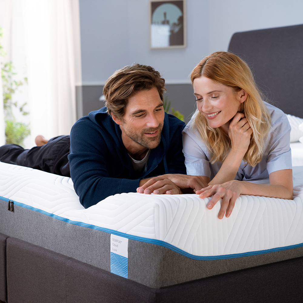 couple in bedroom with mattress