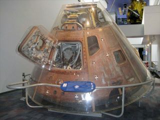 Apollo-Soyuz Test Project command module in its original Plexiglas case at the California Science Center in Los Angeles.