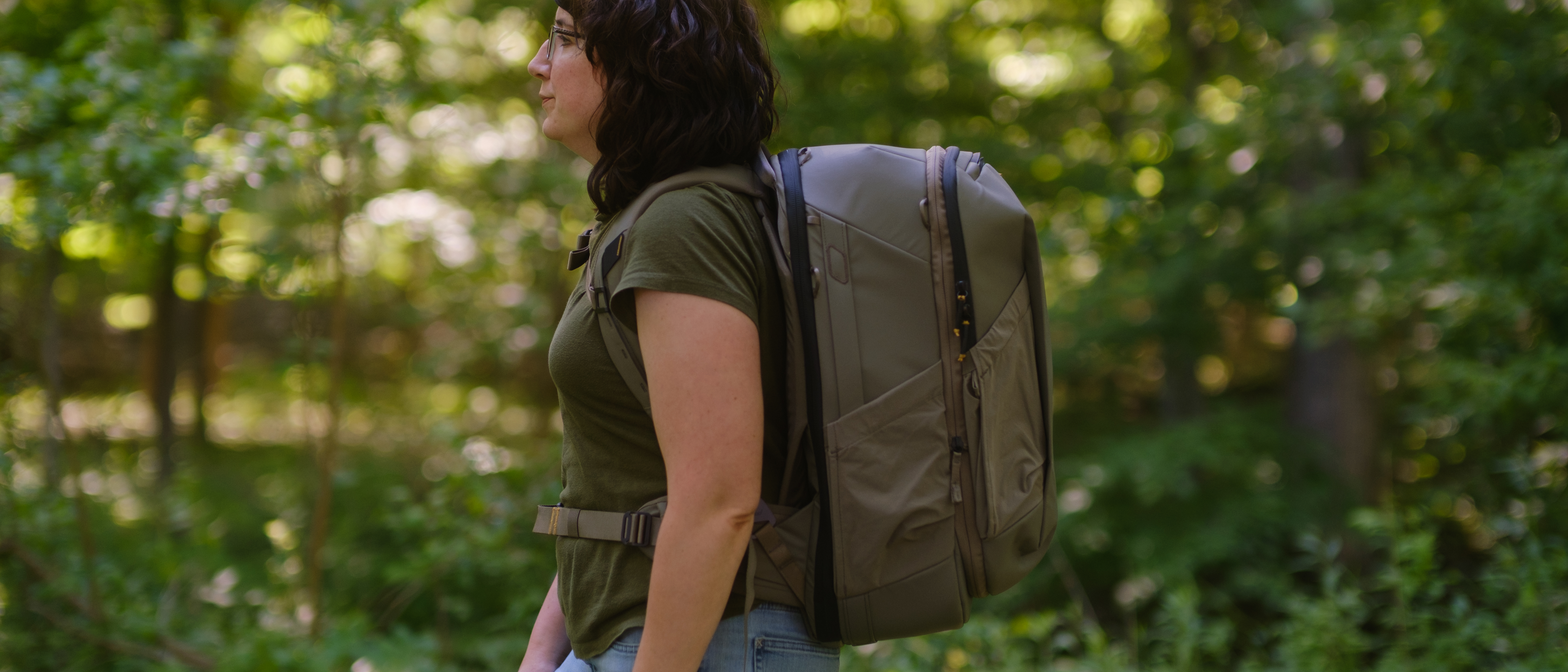 The Peak Design Travel 2-in-1 Backpack outdoors used by a photographer